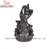 Quemador de incienso de cerámica Ganesh sentado en el escenario de loto