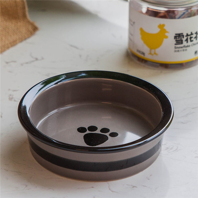 Círculo negro con huellas Pie de perro de cerámica circular impreso Alimentador de mascotas de cerámica rosa Tazón de perro