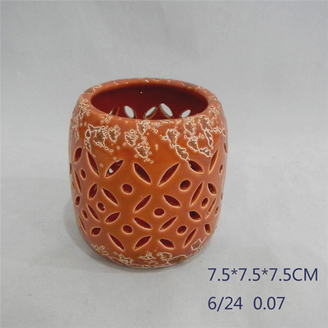 Muebles para el hogar Decoración Naranja rojo Cilindro de cerámica Forma de tira Estilo Ahuecando Huracán Linterna de cerámica